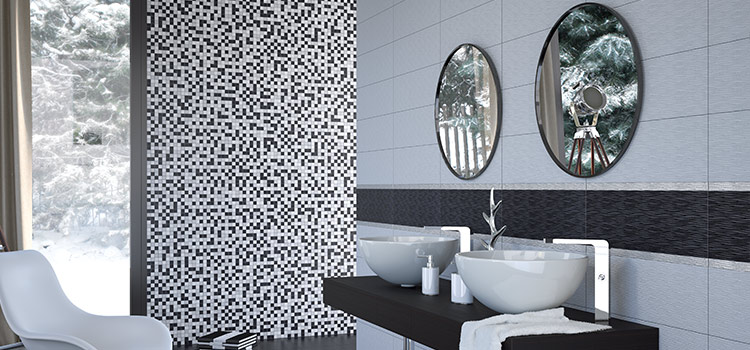 Des zelliges en dégradés de noir et blanc habillent un mur d'une salle d'eau à double vasque.